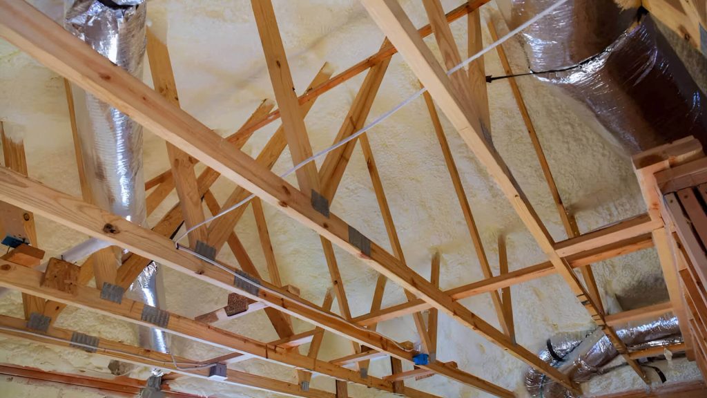 Internal roof structure in exposed wood with foam insulation.